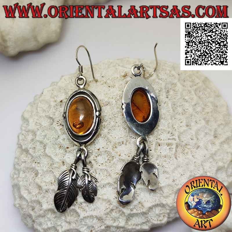 Silver earrings with cabochon oval amber surrounded by a double smooth edge and a pair of hanging feathers