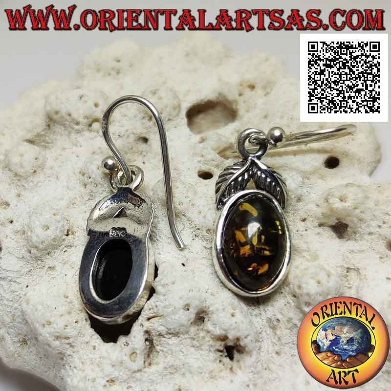 Silver pendant earrings with oval green amber surrounded by a smooth edge and a pair of leaves above