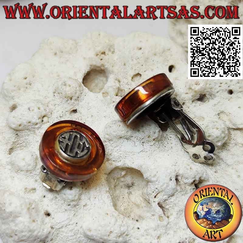 Clip-on silver earrings, amber disc with ethnic decoration inside