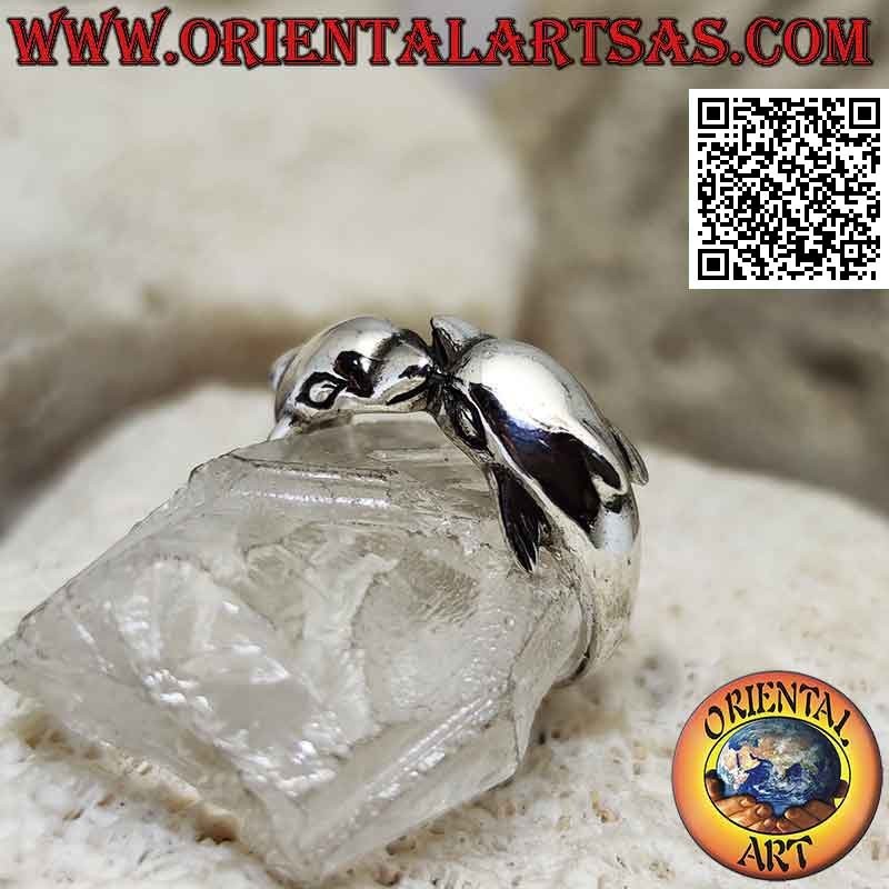 Silver ring, pair of dolphins with fins on the back enveloping in the opposite direction