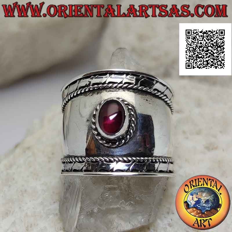 Wide band silver ring with oval garnet and intertwining and stripes on the sides, Bali
