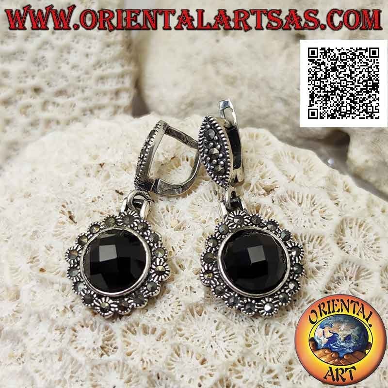 Silver earrings with protruding faceted round onyx and rounded frame studded with marcasite