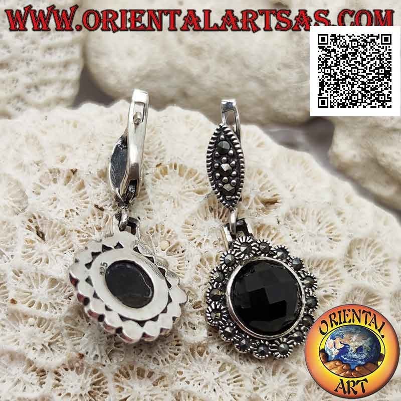 Silver earrings with protruding faceted round onyx and rounded frame studded with marcasite