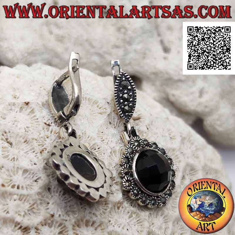 Silver earrings with protruding faceted round onyx and rounded frame studded with marcasite