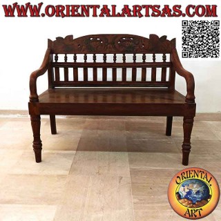 Antique colonial bench with hand-carved floral decoration in teak wood