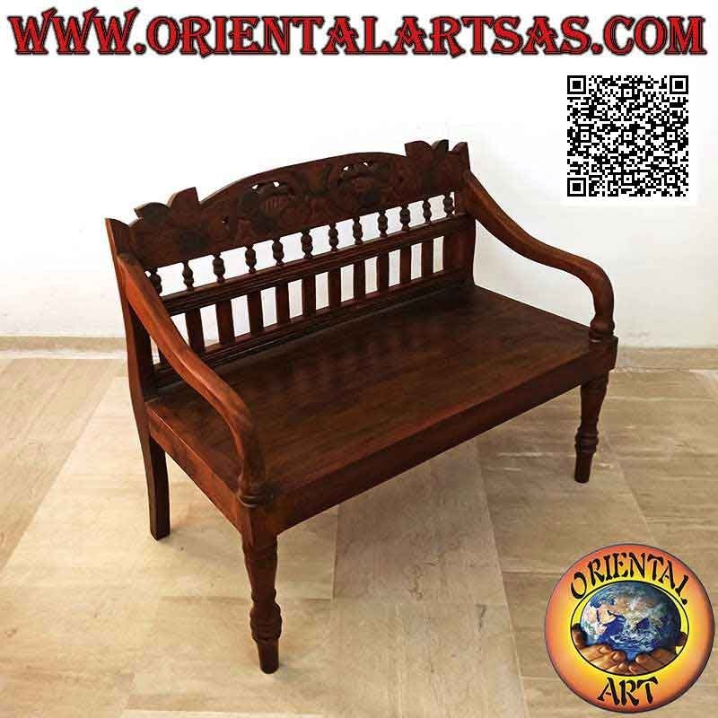Banco colonial antiguo con decoración floral tallada a mano en madera de teca