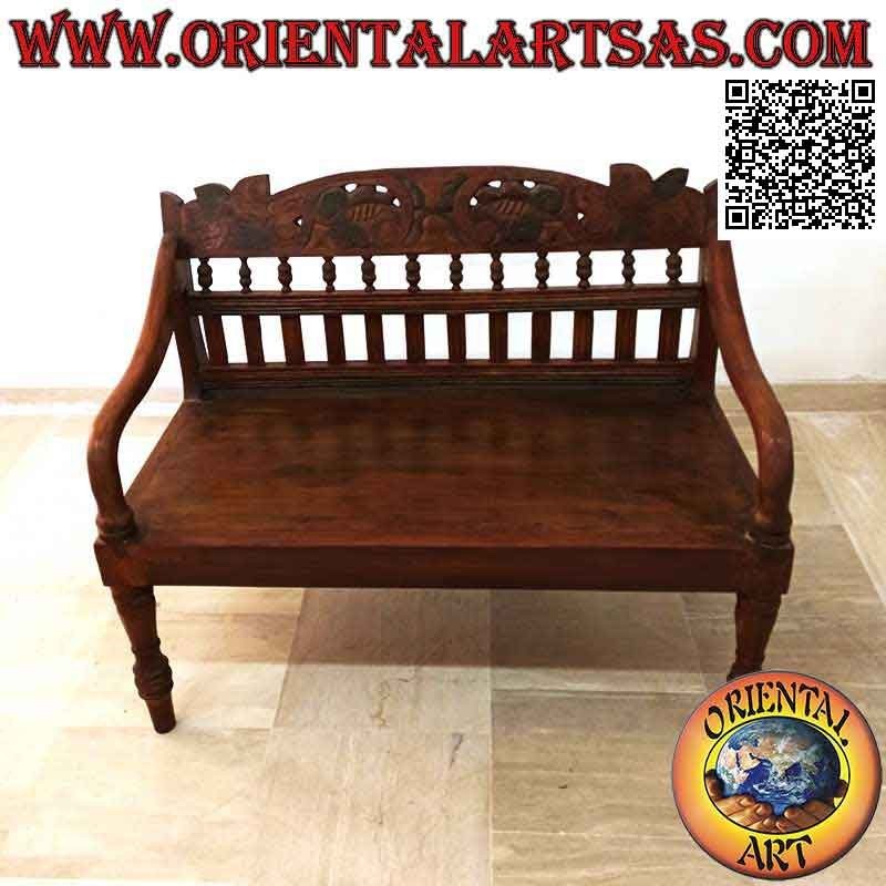 Banco colonial antiguo con decoración floral tallada a mano en madera de teca