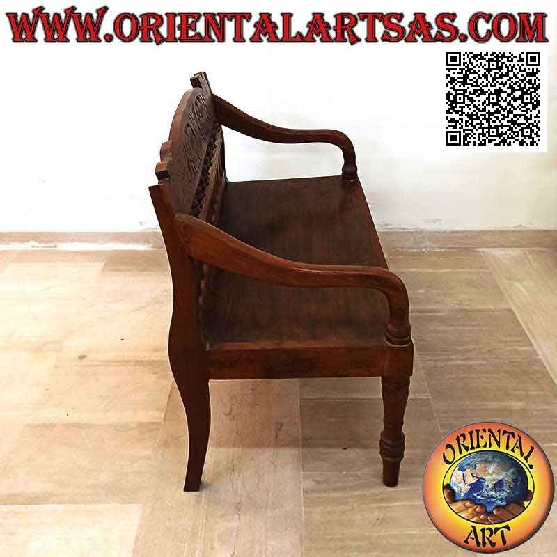 Banco colonial antiguo con decoración floral tallada a mano en madera de teca