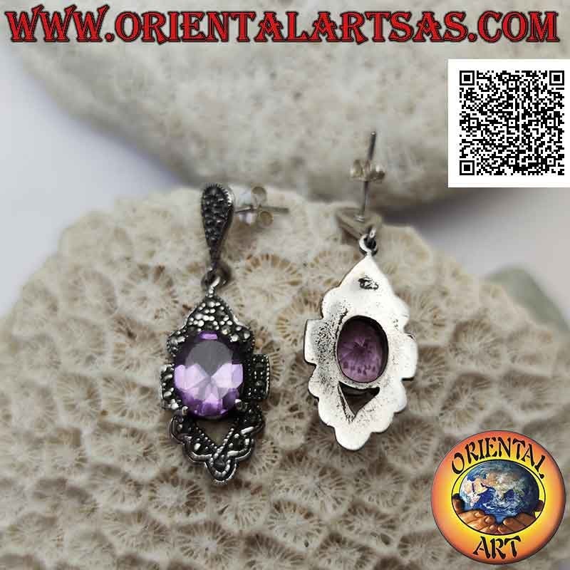 Silver earrings with faceted natural amethyst set protruding on a frame studded with marcasite