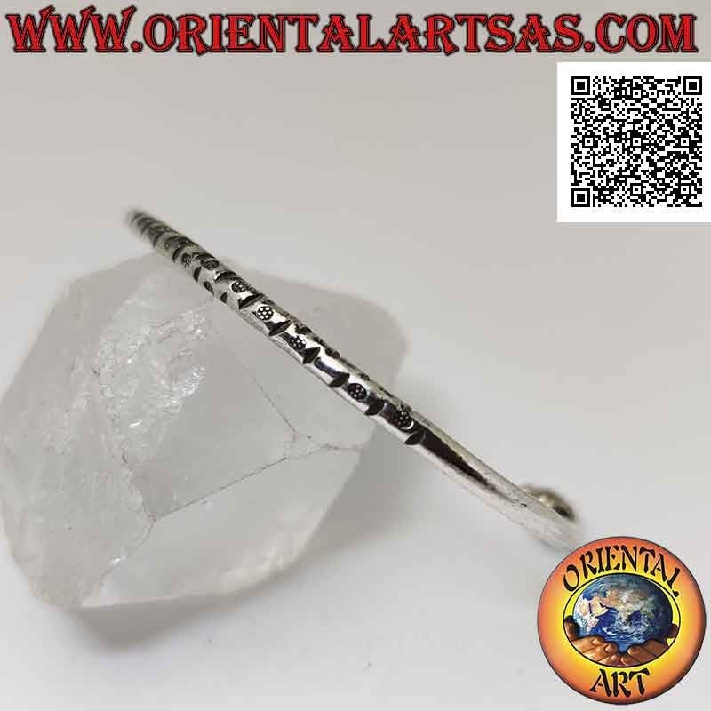 Pulsera rígida redonda en plata 925 ‰ con grabados centrales y trío de donas móviles en los terminales