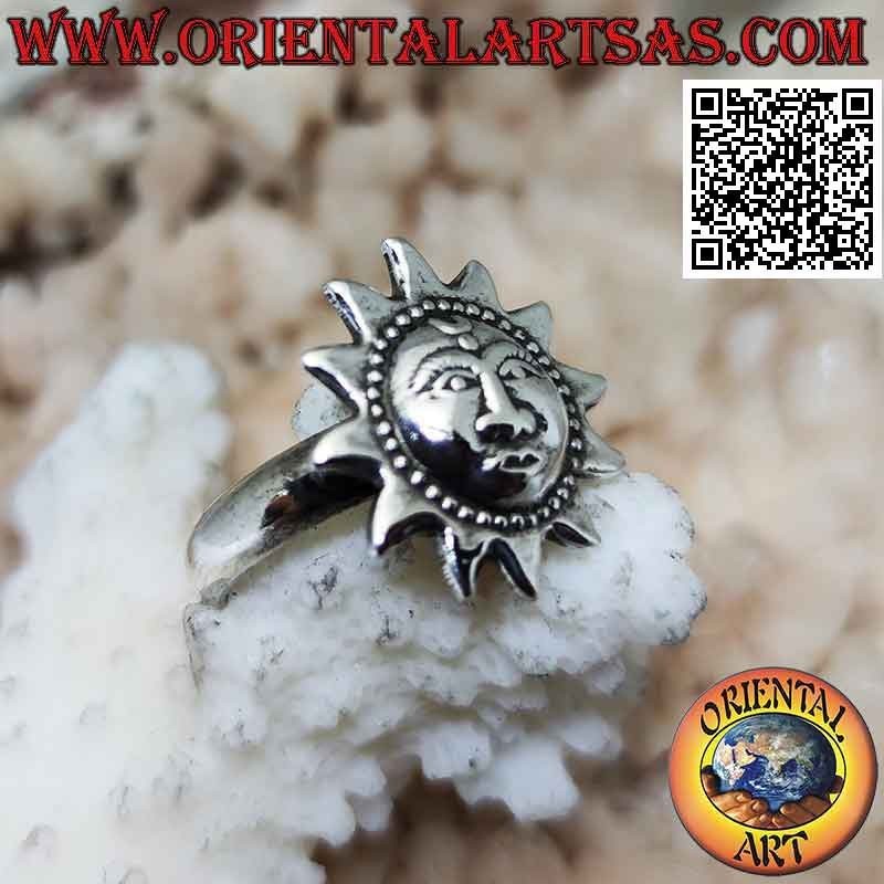 Silver ring in the shape of a sun with a shaped face