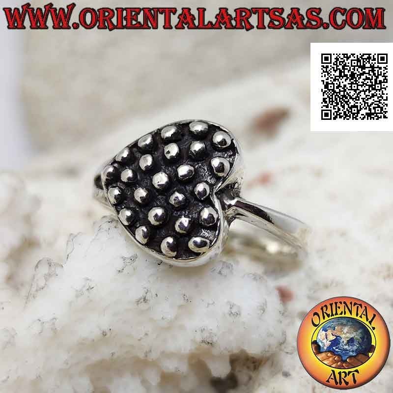 Silver ring in the shape of a horizontal heart with bas-relief dots inside