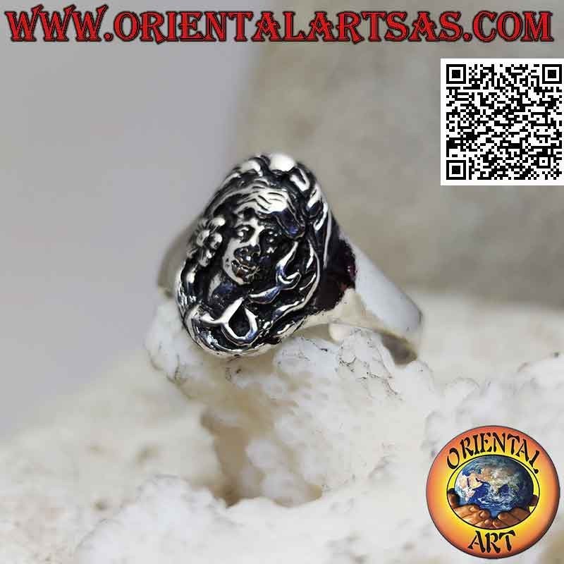 Silver ring with the face of the forest goddess in bas-relief in the oval