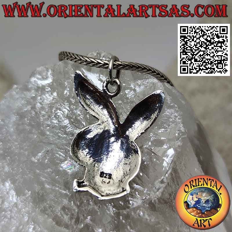 Silver pendant in the shape of a rounded "playboy" bunny with engravings