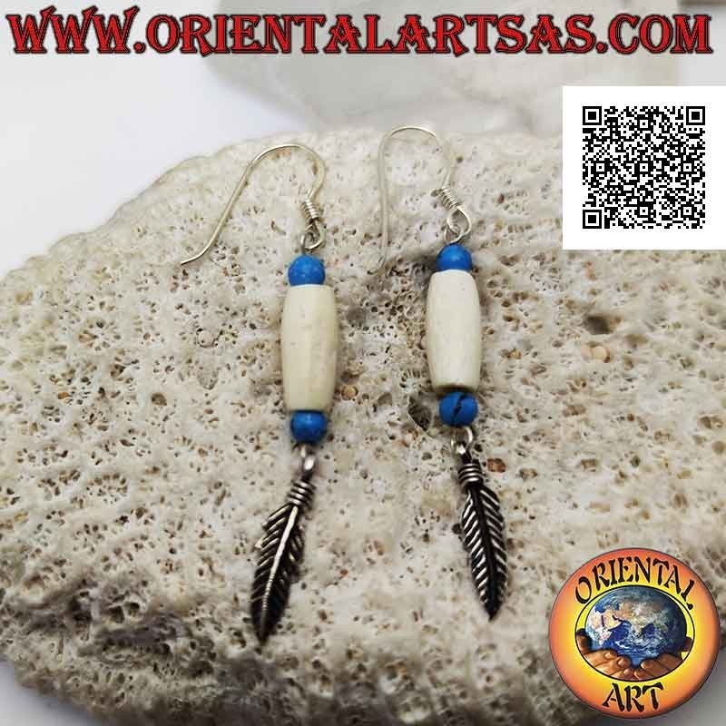 Silver earrings with white cylinder between turquoise beads and pendant feather