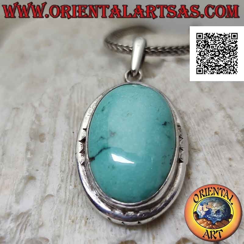 Silver pendant with oval antique turquoise and smooth protruding edge engraved on the cardinal points