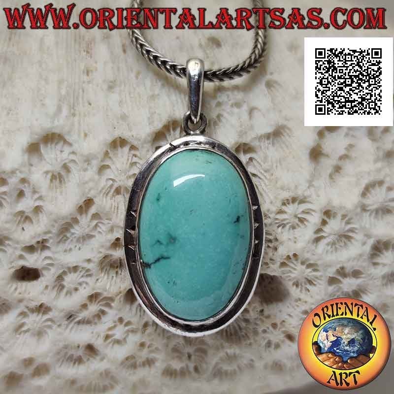 Silver pendant with oval antique turquoise and smooth protruding edge engraved on the cardinal points
