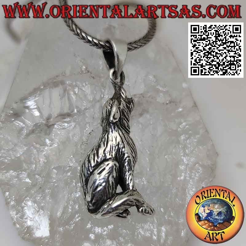 Silver pendant in the shape of a three-dimensional howling wolf