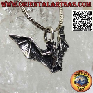 Silver pendant in the shape of a bat with large spread wings