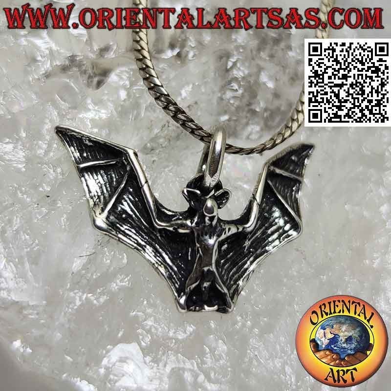 Silver pendant in the shape of a bat with large spread wings