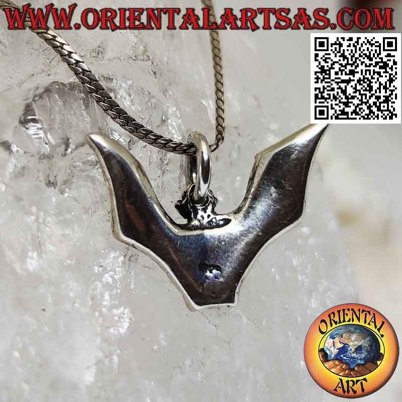 Silver pendant in the shape of a bat with large spread wings