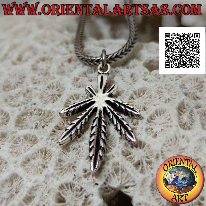 Silver pendant in the shape of a symmetrical marijuana leaf with deep engravings