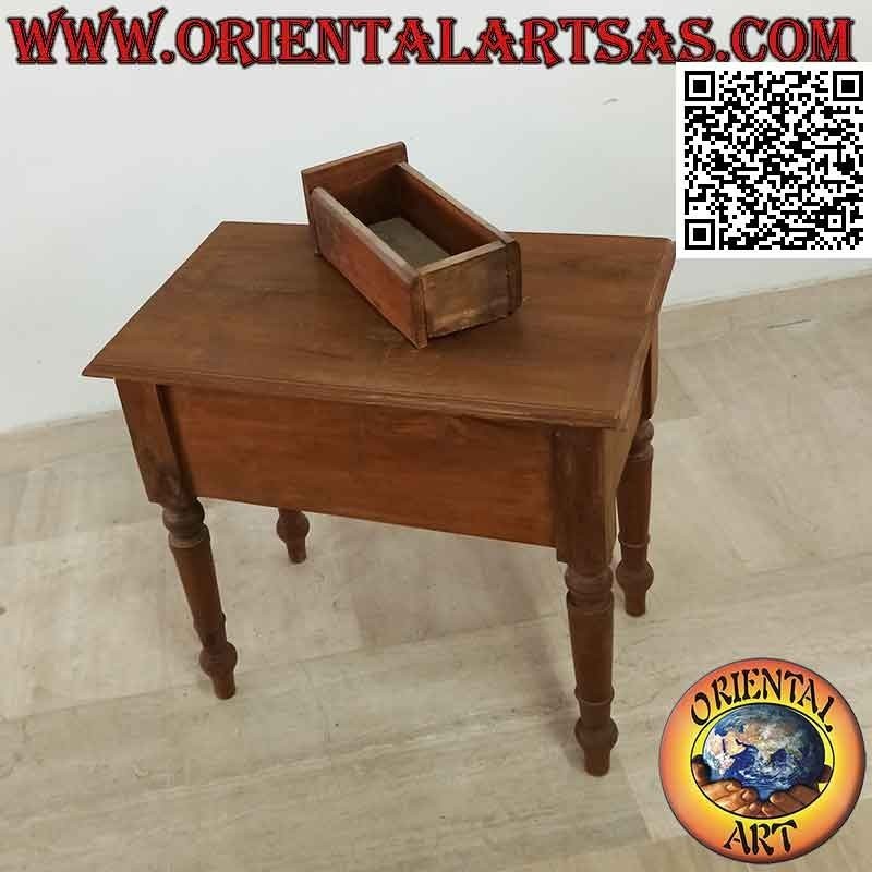 Ethnic coffee table with drawer among sunflowers in relief in teak wood