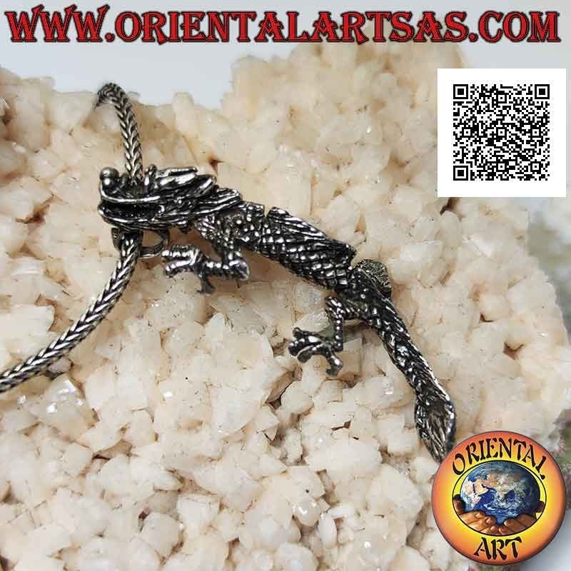 Silver pendant in the shape of an oriental (Chinese) dragon in three-dimensional movable integral