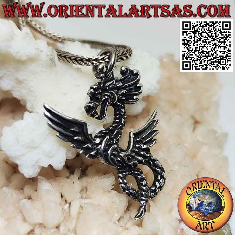 Silver pendant in the shape of a twisted amphitterous dragon in pose