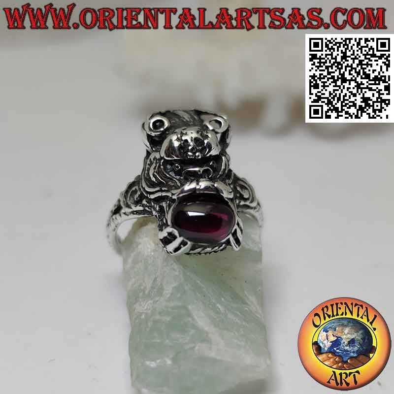 Nepalese dragon-shaped silver ring with natural oval garnet in the mouth
