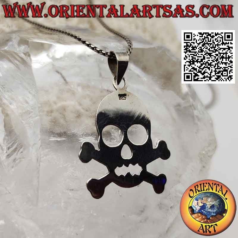 Smooth silver pendant in the shape of a skull on the two crossed femoral bones