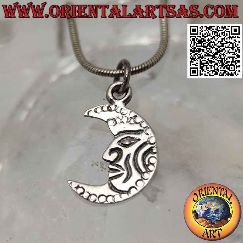 Silver pendant, flat crescent decorated with engraved face