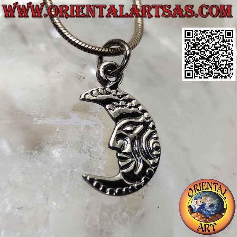 Silver pendant, flat crescent decorated with engraved face
