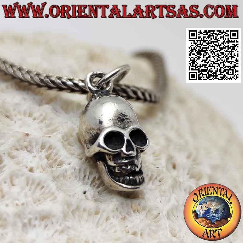 Silver pendant in the shape of a three-dimensional skull with wide open eyes (small)