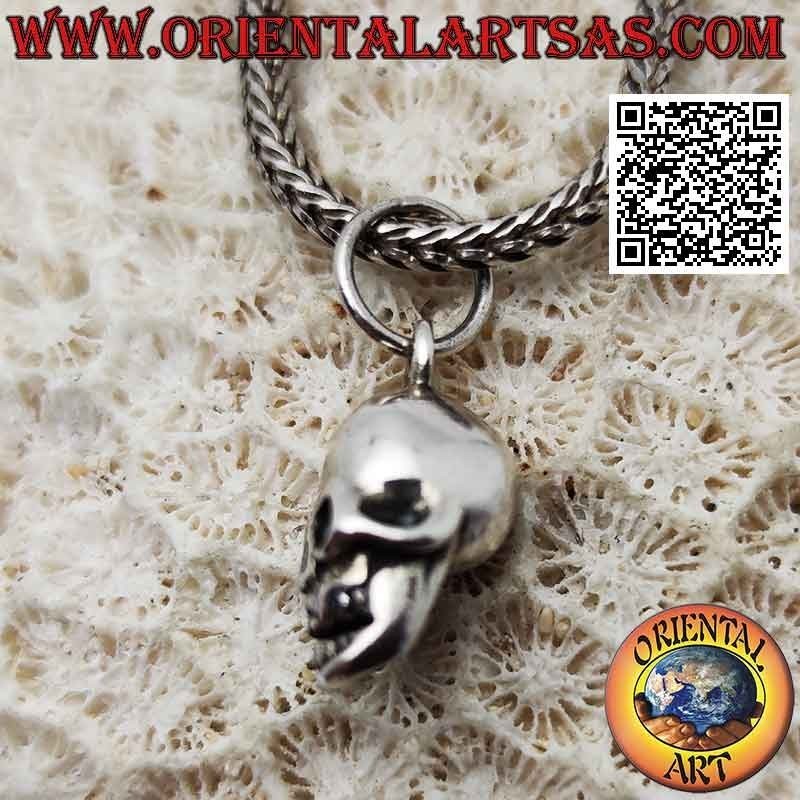 Silver pendant in the shape of a three-dimensional skull with wide open eyes (small)
