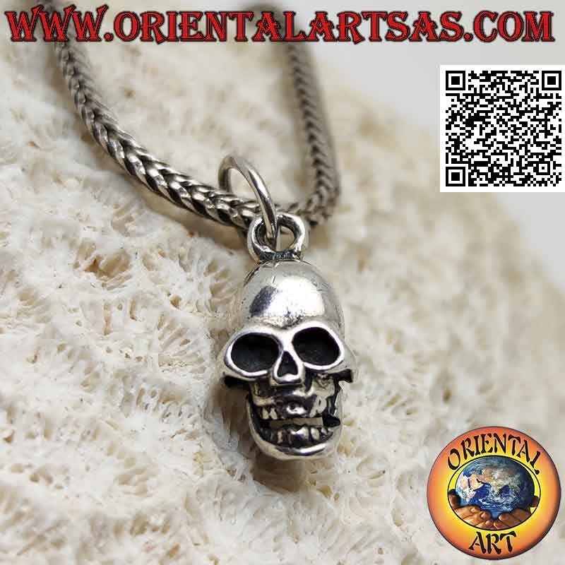 Silver pendant in the shape of a three-dimensional skull with wide open eyes (small)