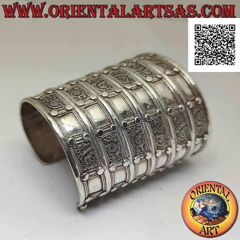 Wide rigid bracelet in 925 ‰ silver "alla schiava" with relief decorations (8.7 cm)