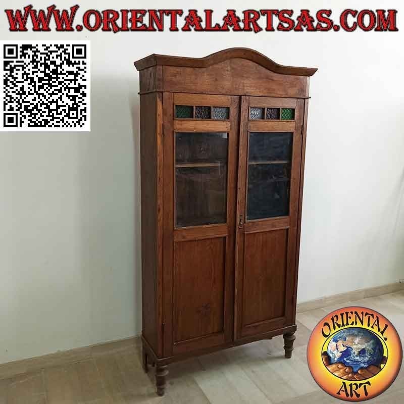 Antique showcase with two doors with colored glass in teak wood