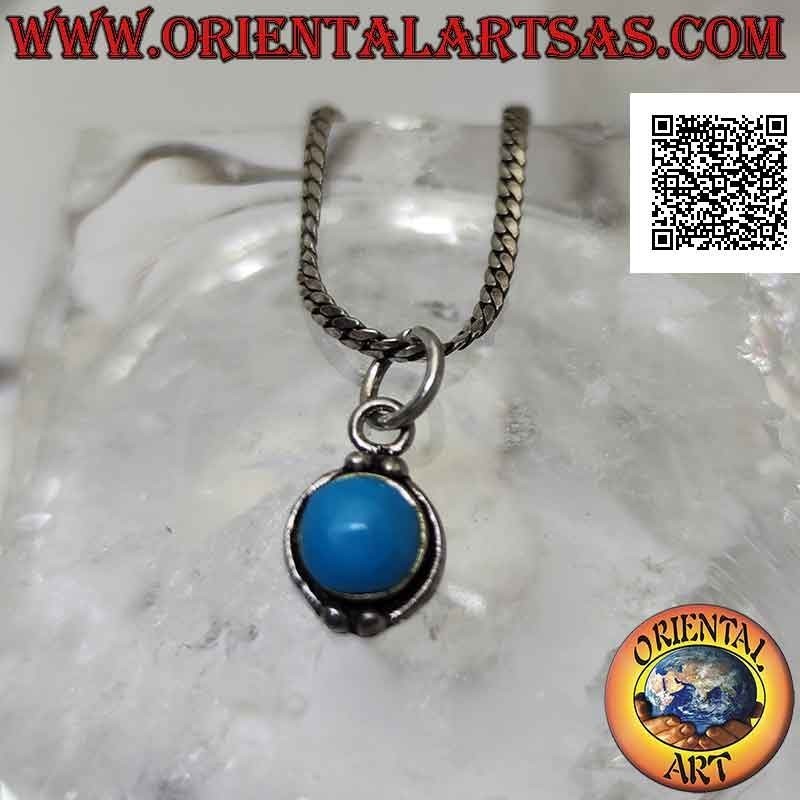 Silver pendant with round cabochon turquoise paste and a pair of balls above and below