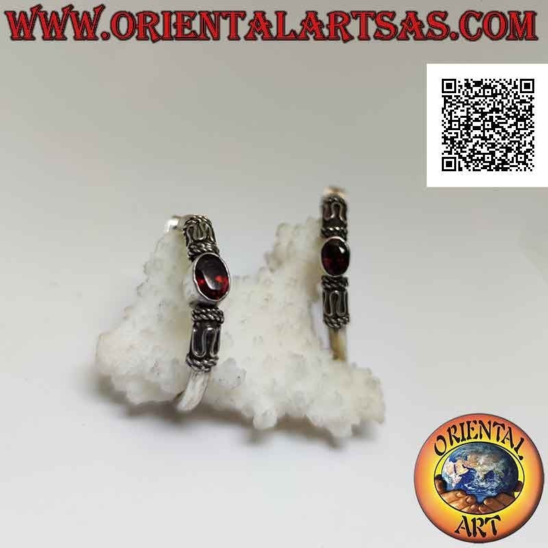 Silver hoop earrings with oval natural garnet between serpentine and intertwining (32 mm)