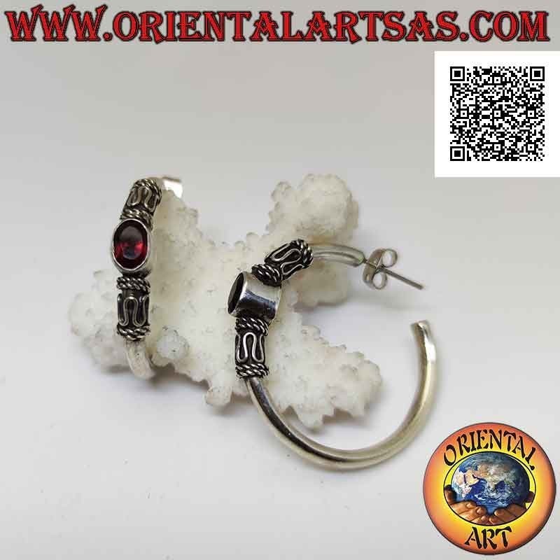 Silver hoop earrings with oval natural garnet between serpentine and intertwining (32 mm)