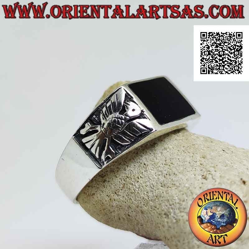 Silver ring with horizontal rectangular onyx flush with the edge and eagle in bas-relief on the sides