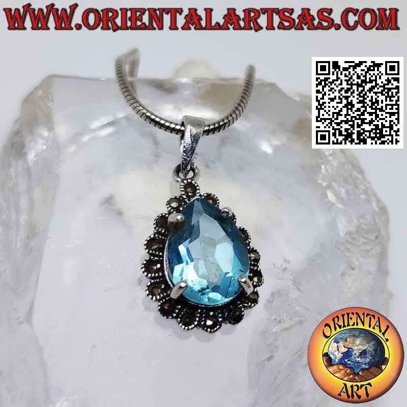 Colgante de plata con topacio azul en forma de gota rodeado de marcasita
