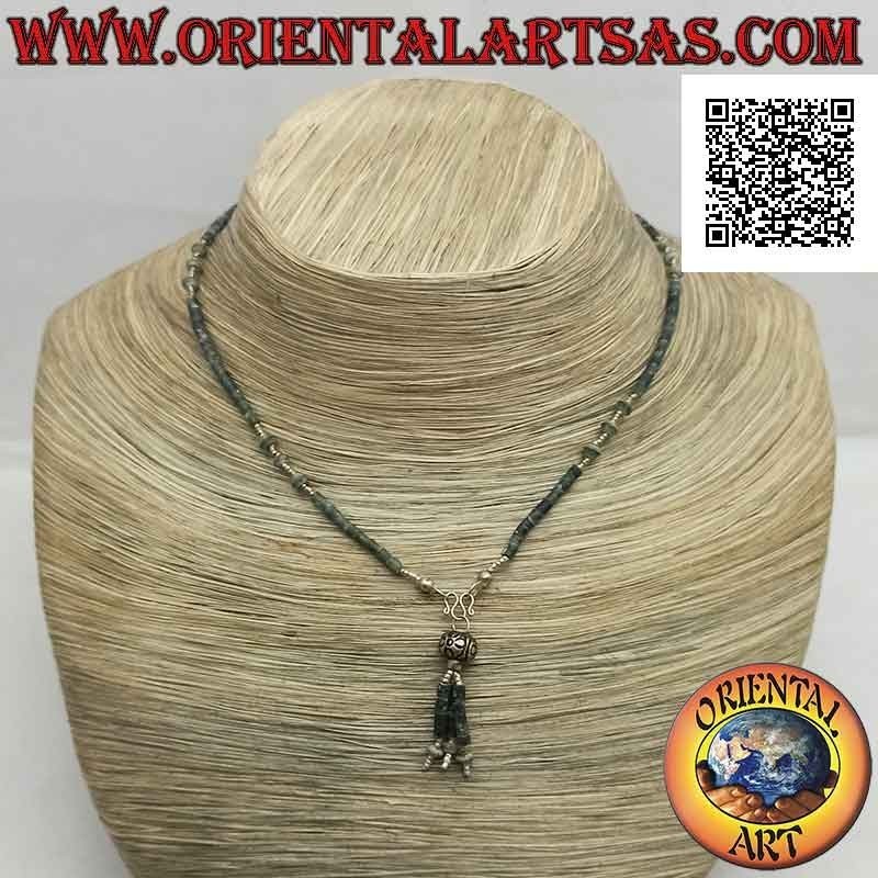Choker necklace of tubes and fragments of raw jade and 925 ‰ silver strung with a tuft