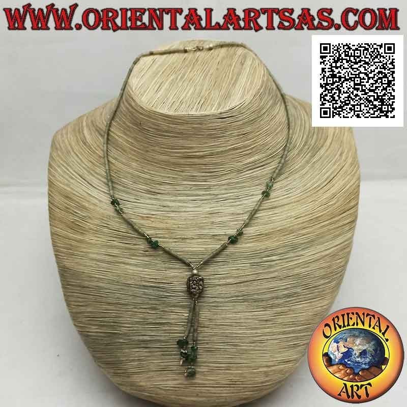 Choker necklace of tubes and fragments of raw green jade and 925 ‰ silver strung with a tuft