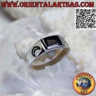 Smooth silver ring with rectangular onyx and sun and moon engraved on the sides