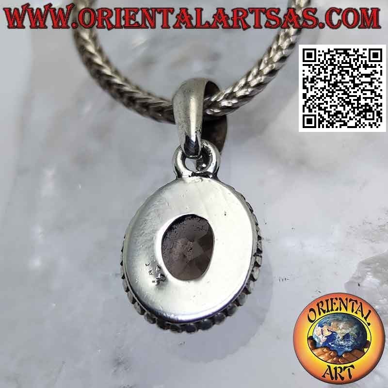 Silver pendant with oval smoky topaz surrounded by weaving