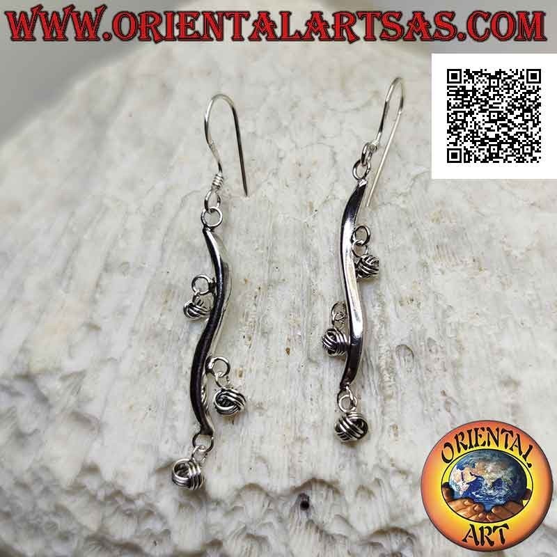 Silver earrings with wavy line hooks with dangling balls of intertwining
