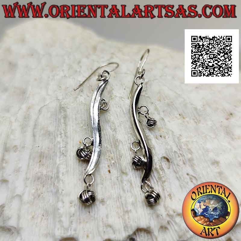 Silver earrings with wavy line hooks with dangling balls of intertwining