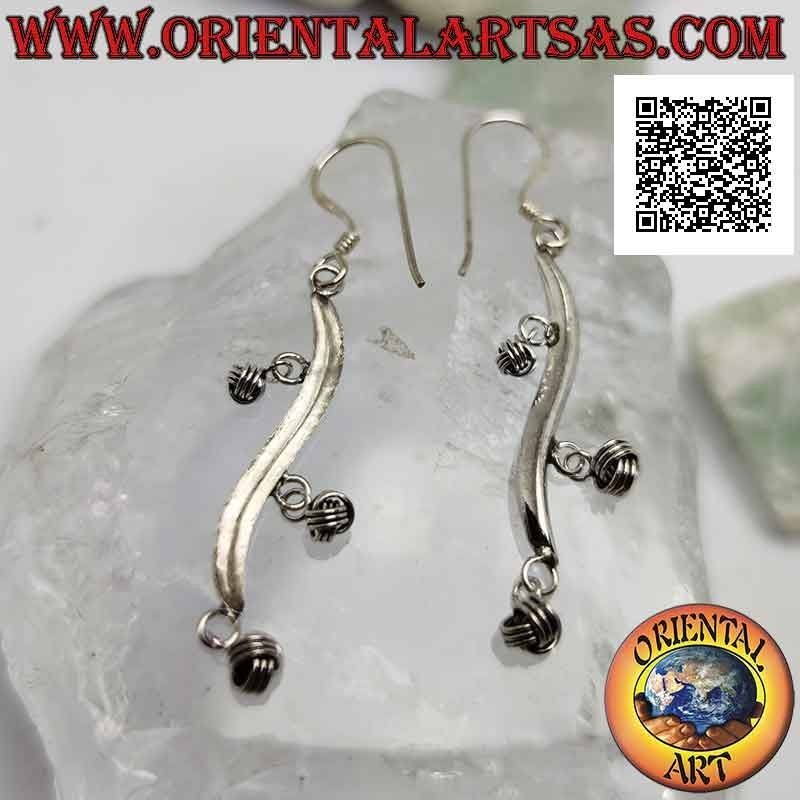Silver earrings with wavy line hooks with dangling balls of intertwining